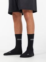 Calcetines de gym negros con la marca Squat.